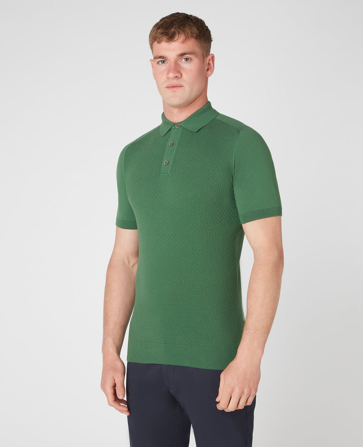 Man wearing a green Slim Fit Knitted Cotton Short-Sleeve Polo Shirt