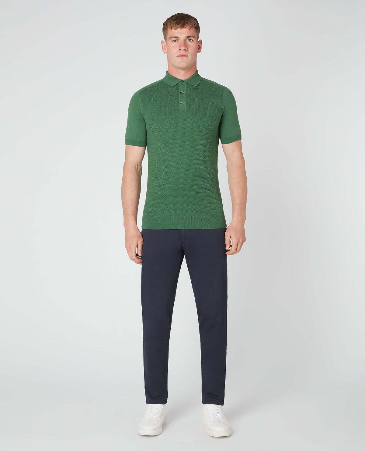 Man wearing a green Slim Fit Knitted Cotton Short-Sleeve Polo Shirt