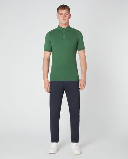 Man wearing a green Slim Fit Knitted Cotton Short-Sleeve Polo Shirt