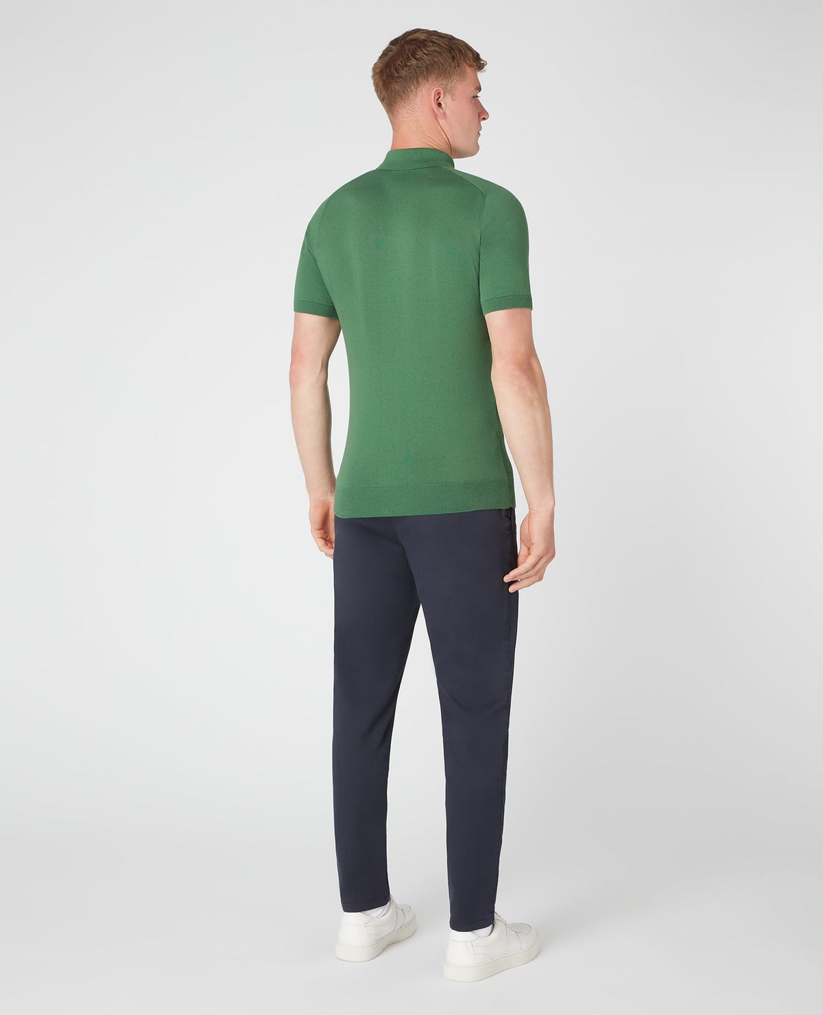 Man wearing a green Slim Fit Knitted Cotton Short-Sleeve Polo Shirt
