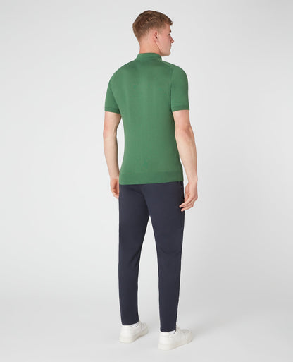 Man wearing a green Slim Fit Knitted Cotton Short-Sleeve Polo Shirt