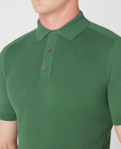 Man wearing a green Slim Fit Knitted Cotton Short-Sleeve Polo Shirt
