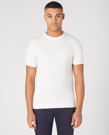Man wearing a white Slim Fit Knitted Cotton Crew Neck Tee