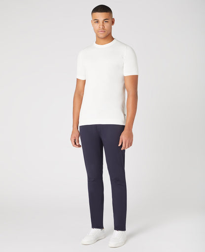 Man wearing a white Slim Fit Knitted Cotton Crew Neck Tee