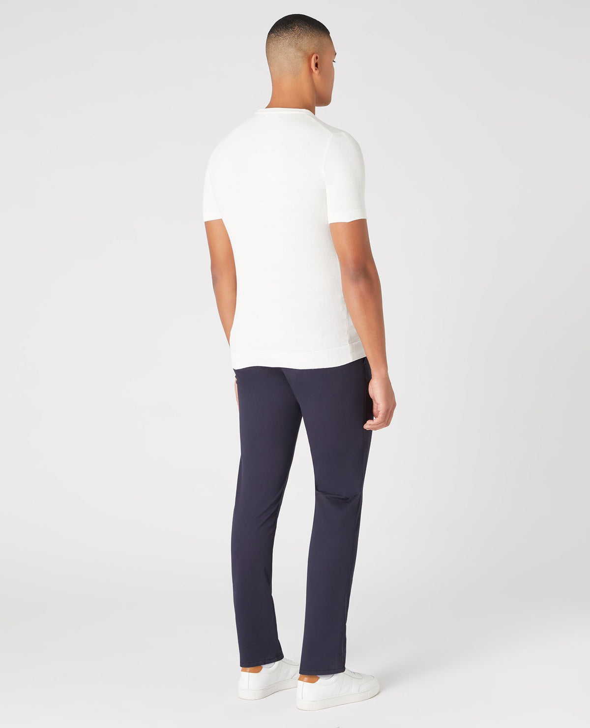 Man wearing a white Slim Fit Knitted Cotton Crew Neck Tee