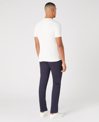 Man wearing a white Slim Fit Knitted Cotton Crew Neck Tee