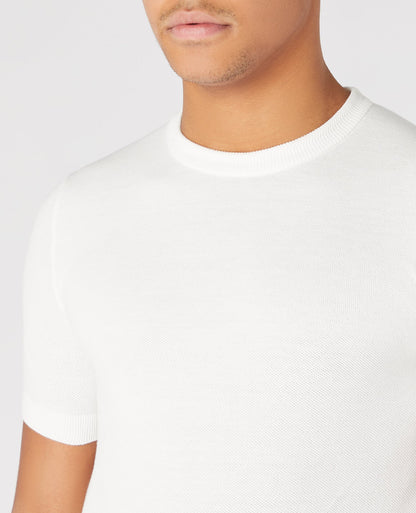 Man wearing a white Slim Fit Knitted Cotton Crew Neck Tee