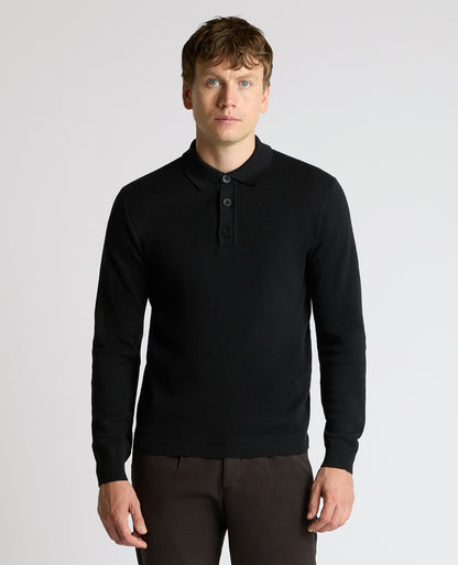 Man wearing a black Long Sleeve Cotton Knit Polo