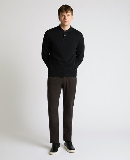 Man wearing a black Long Sleeve Cotton Knit Polo