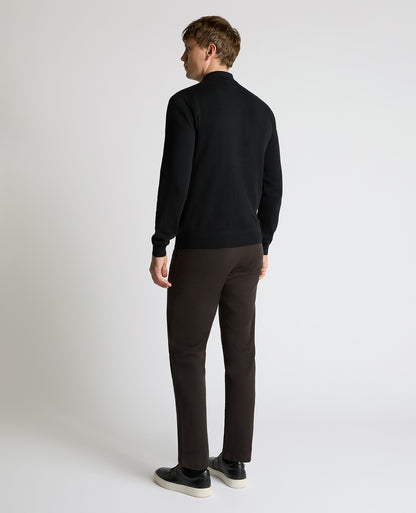 Man wearing a black Long Sleeve Cotton Knit Polo