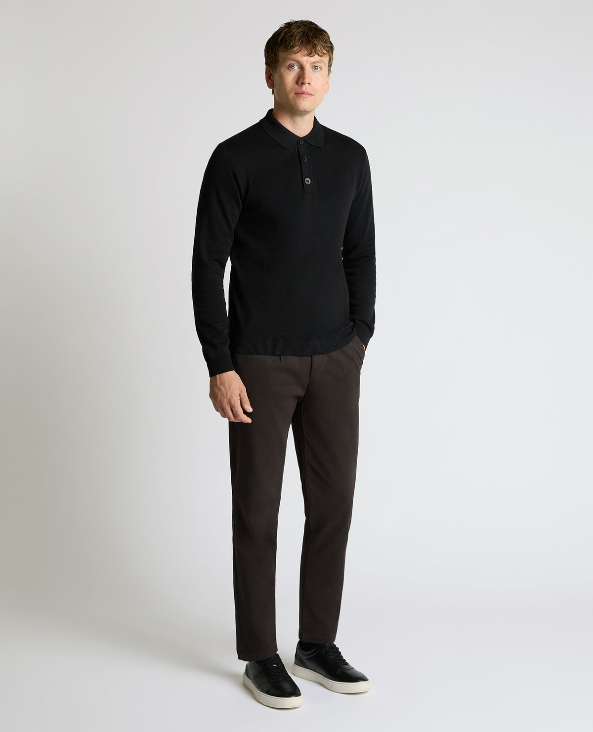 Man wearing a black Long Sleeve Cotton Knit Polo