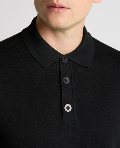 Man wearing a black Long Sleeve Cotton Knit Polo