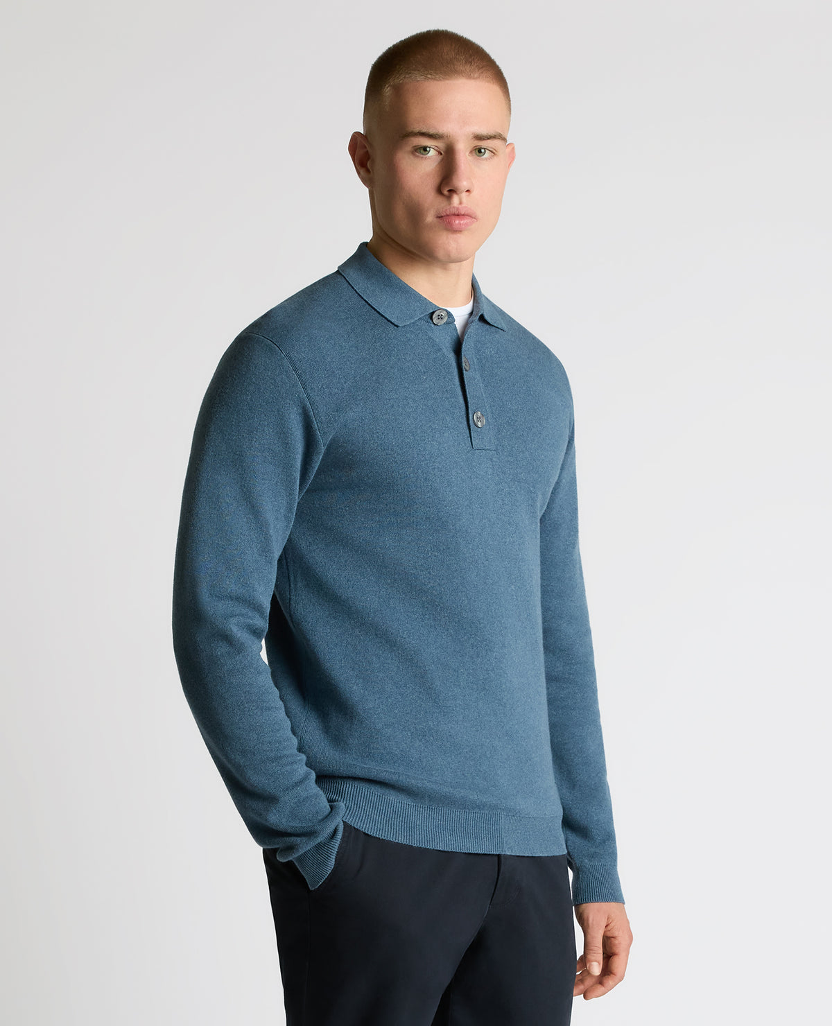 Man wearing a blue Long Sleeve Cotton Knit Polo