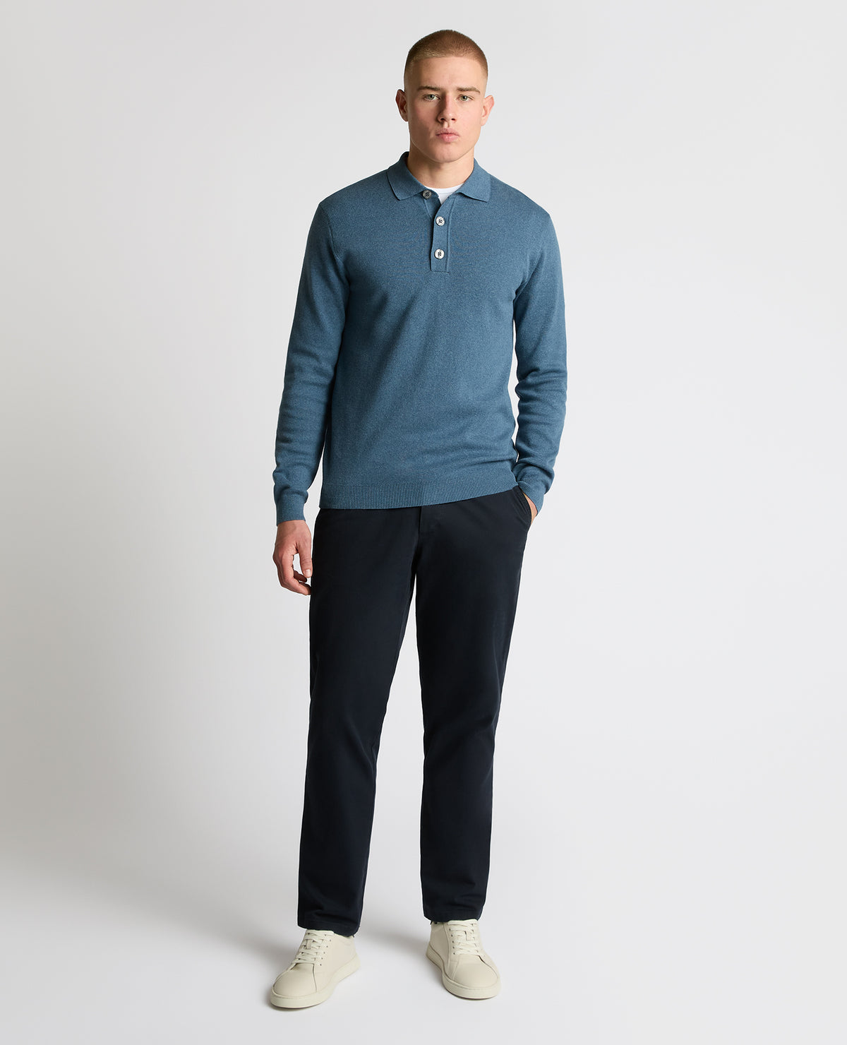 Man wearing a blue Long Sleeve Cotton Knit Polo