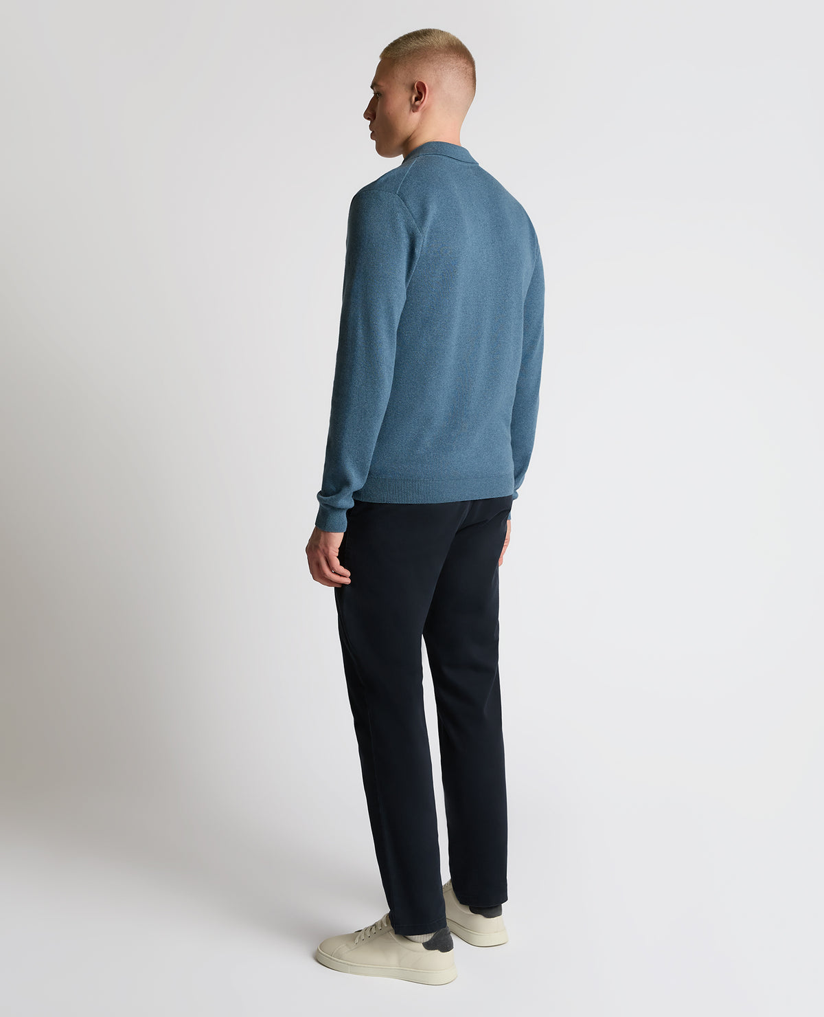 Man wearing a blue Long Sleeve Cotton Knit Polo
