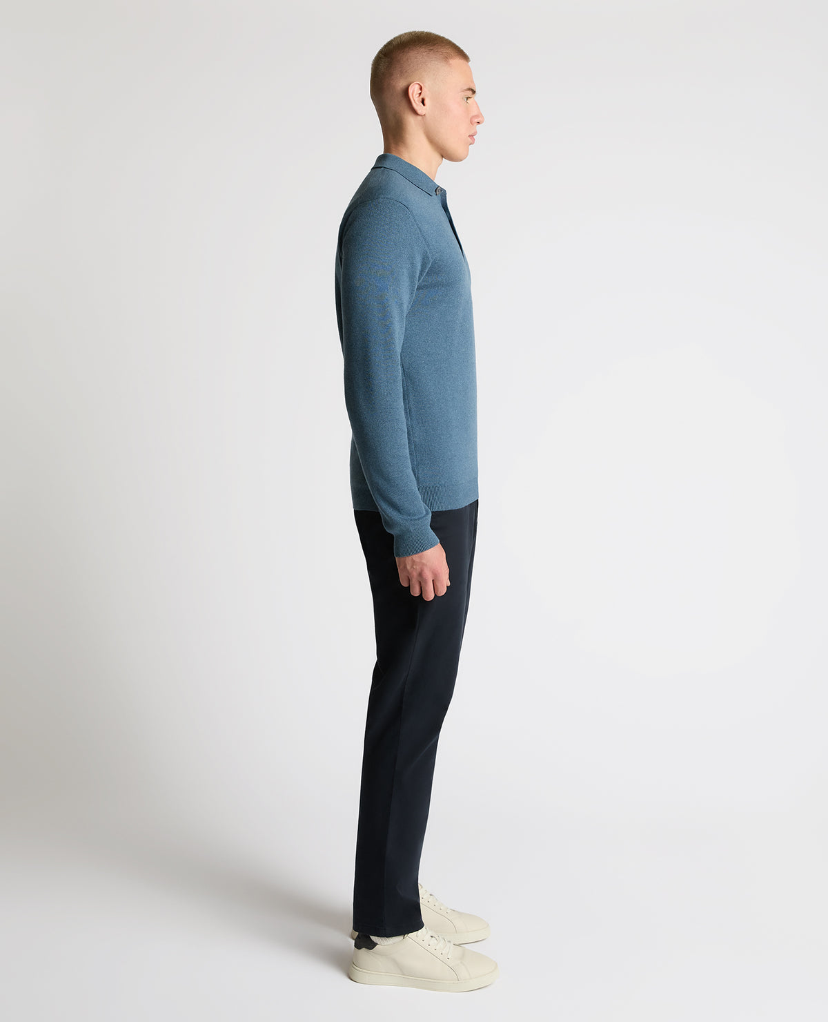 Man wearing a blue Long Sleeve Cotton Knit Polo