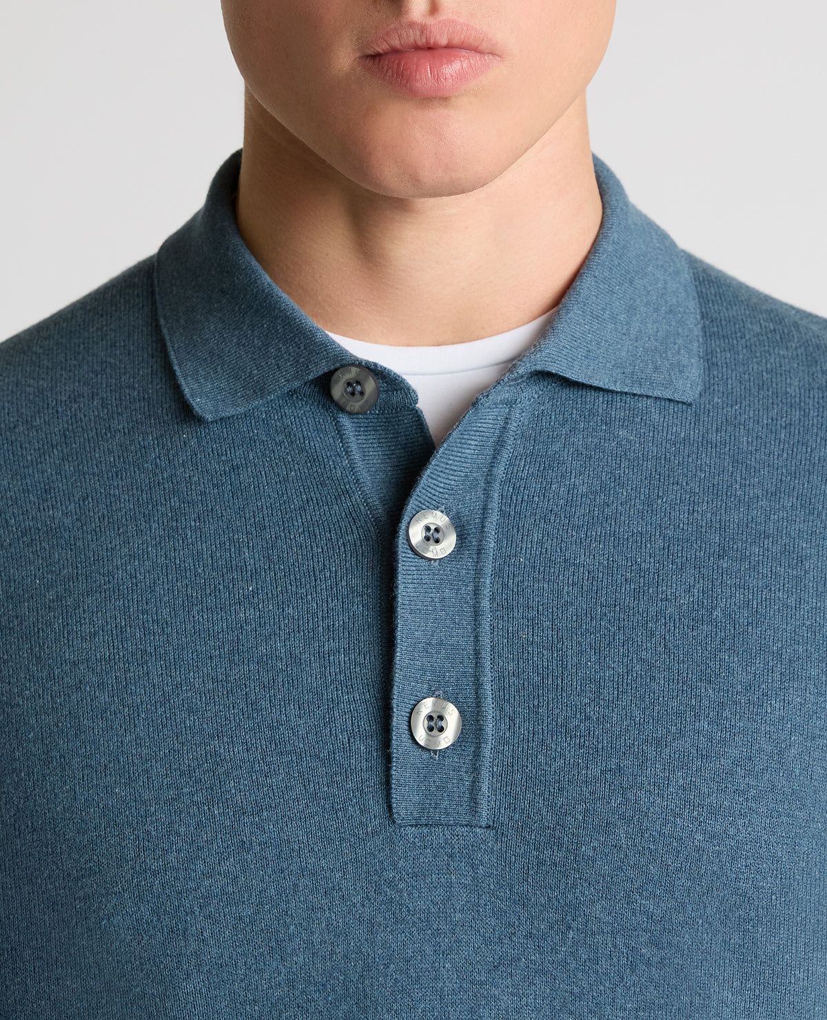 Man wearing a blue Long Sleeve Cotton Knit Polo
