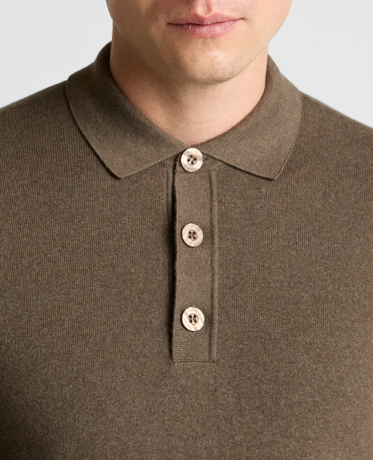 Man wearing a brown Long Sleeve Cotton Knit Polo