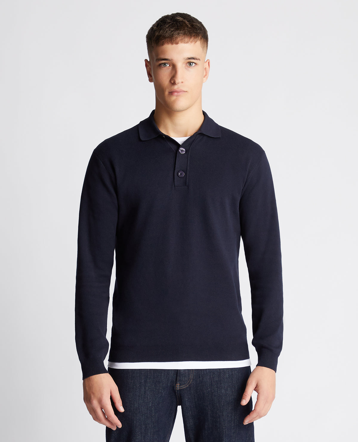 Man wearing a navy Relaxed Fit Long Sleeve Polo
