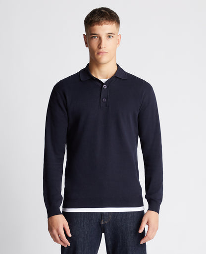 Man wearing a navy Relaxed Fit Long Sleeve Polo