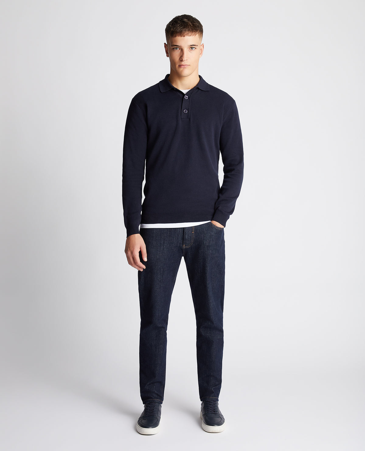 Man wearing a navy Relaxed Fit Long Sleeve Polo