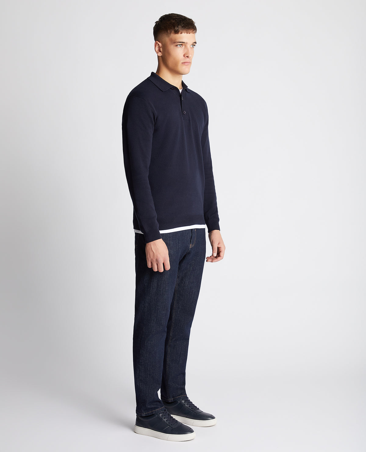 Man wearing a navy Relaxed Fit Long Sleeve Polo