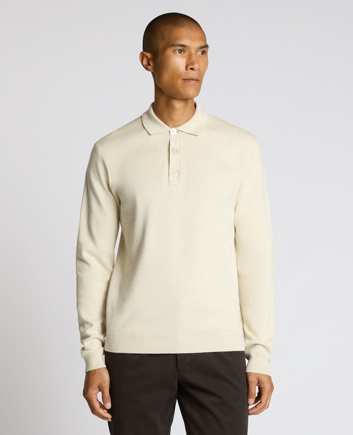 Man wearing a sand Long Sleeve Cotton Knit Polo