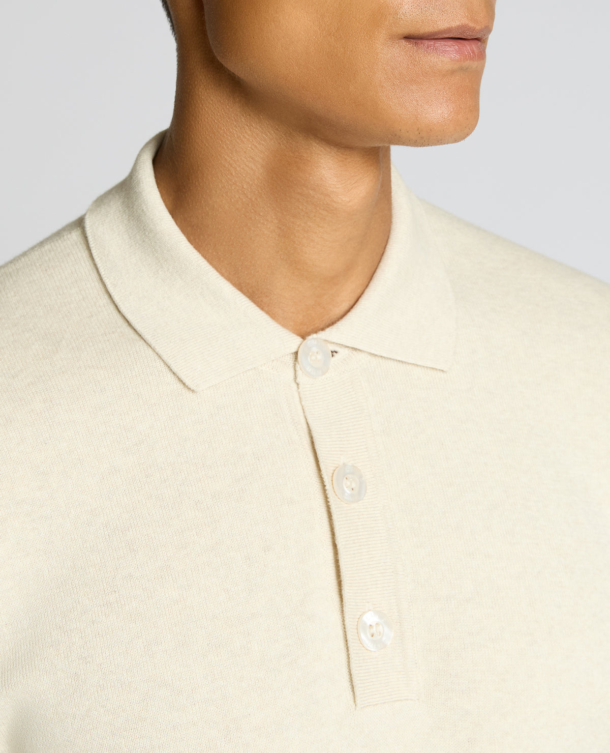 Man wearing a sand Long Sleeve Cotton Knit Polo
