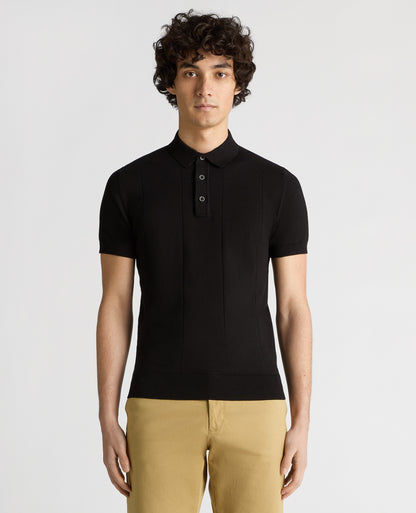 Man wearing a black Slim Fit Knitted Cotton Short-Sleeve Polo