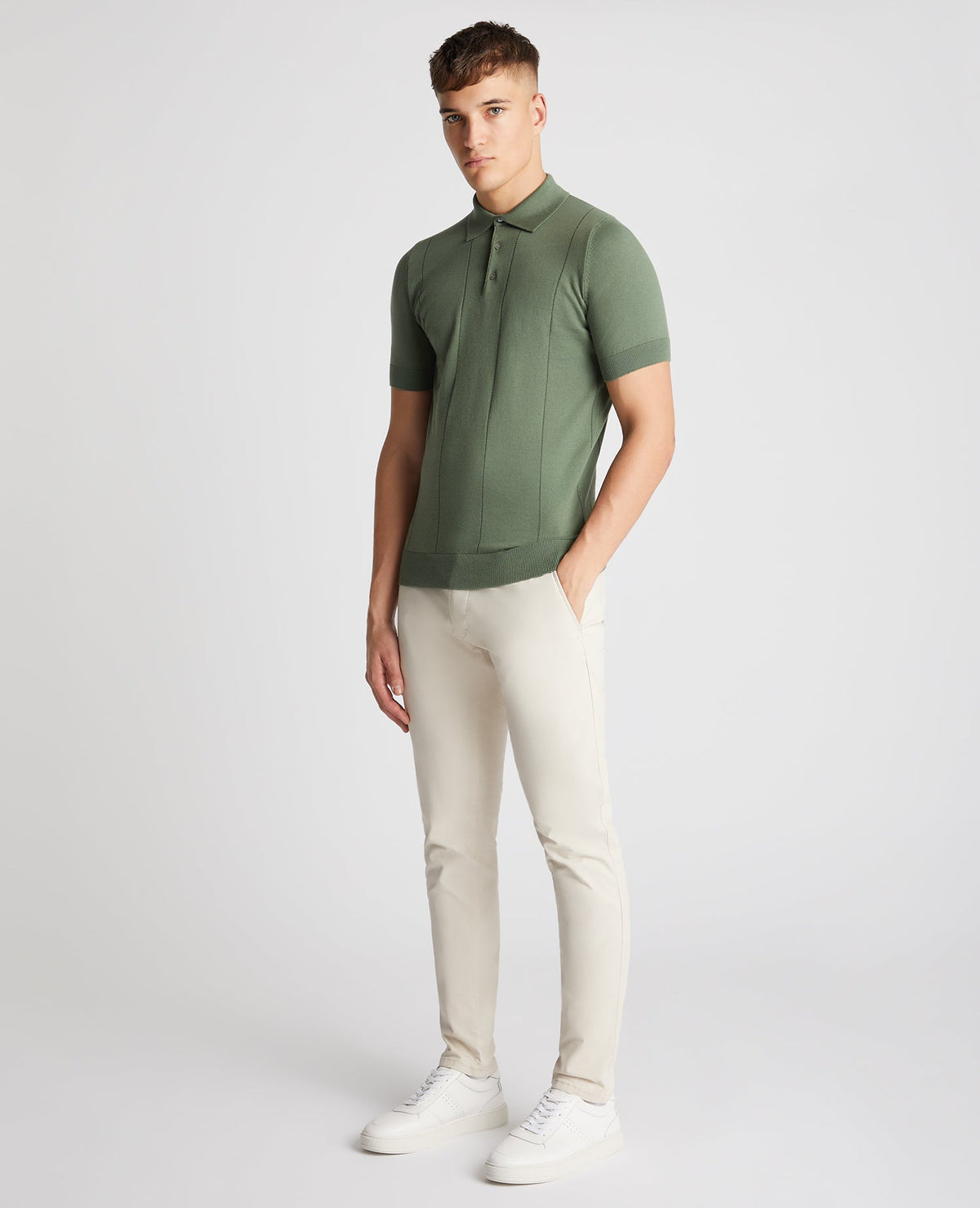 Man wearing a green Slim Fit Knitted Cotton Short-Sleeve Polo