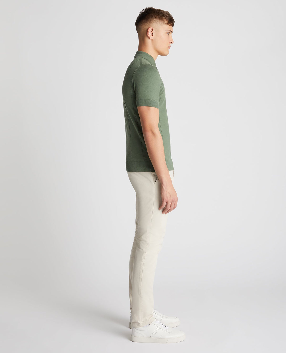 Man wearing a green Slim Fit Knitted Cotton Short-Sleeve Polo