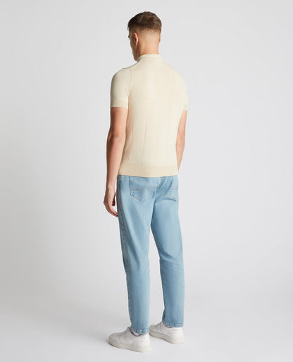 Man wearing a sand Slim Fit Knitted Cotton Short-Sleeve Polo