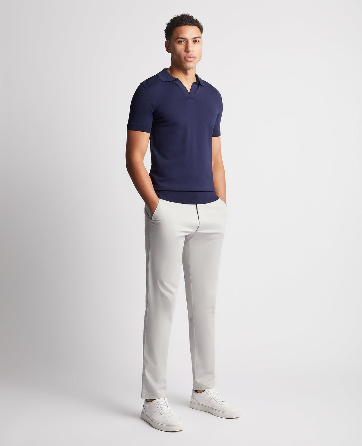 Man wearing a navy Knitted Short-Sleeve Polo