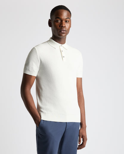 Man wearing a white Slim Fit Cotton Interest Fabric Polo Shirt