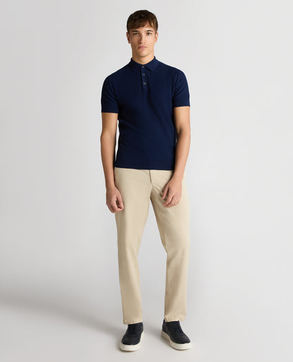 Man wearing a blue Slim Fit Cotton Interest Fabric Polo Shirt