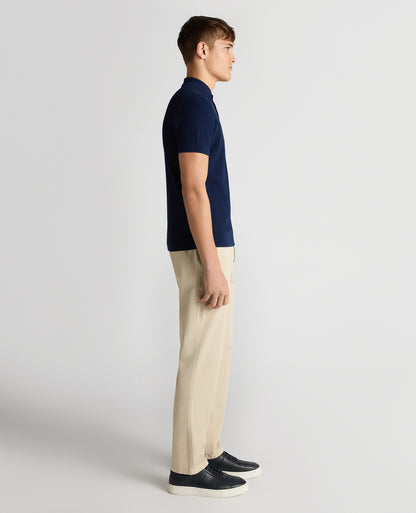 Man wearing a blue Slim Fit Cotton Interest Fabric Polo Shirt