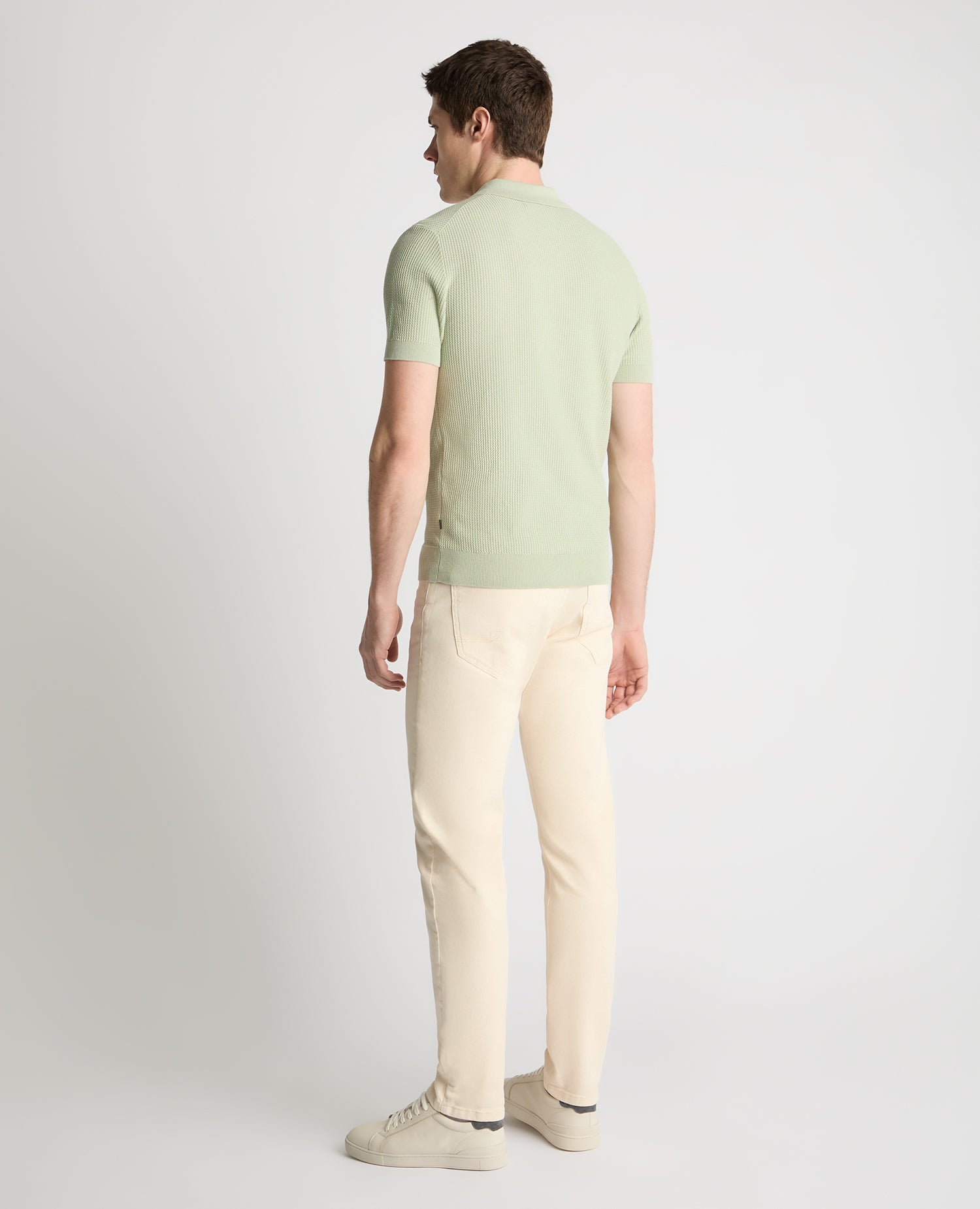 Man wearing a green jumper
