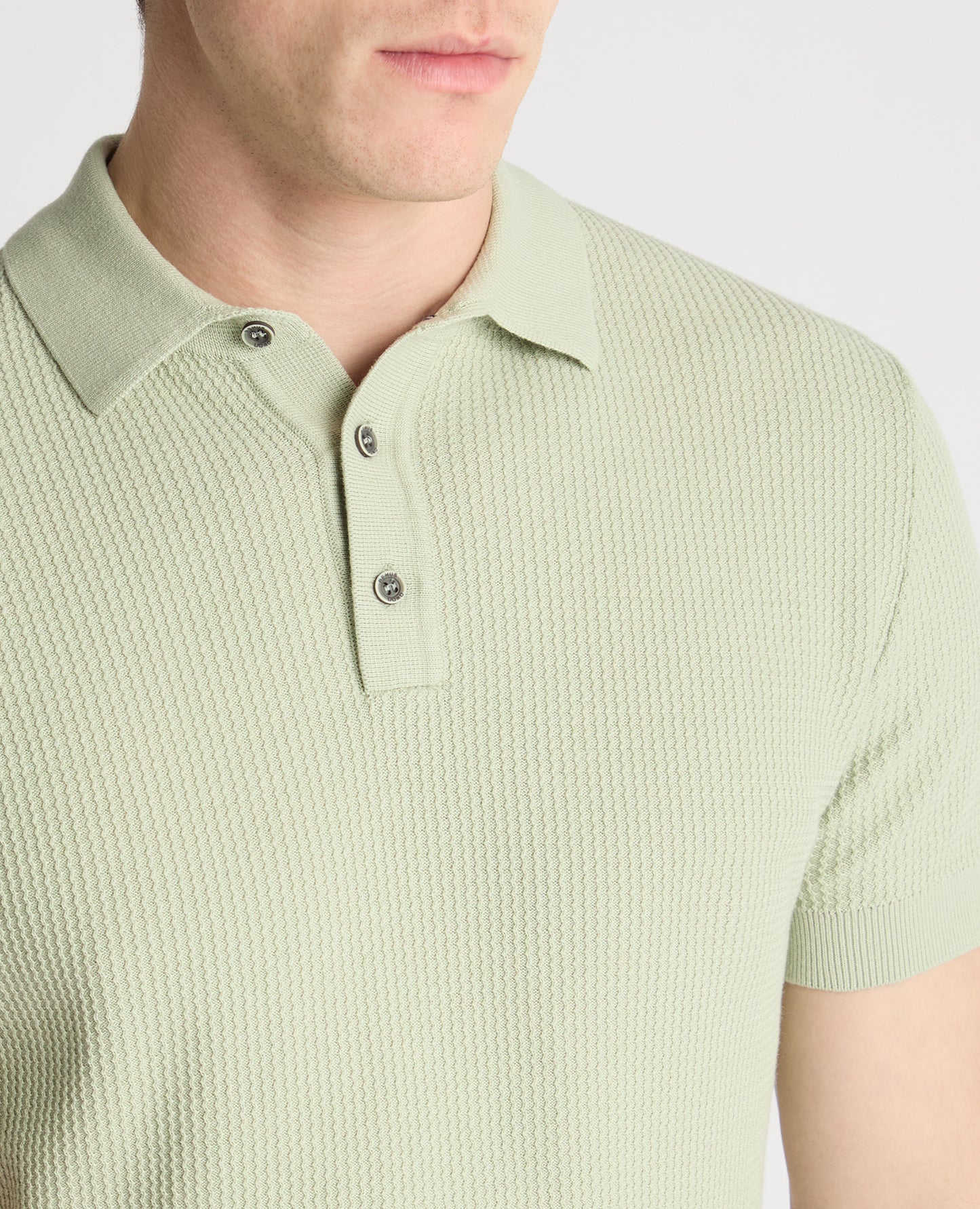 Man wearing a green jumper