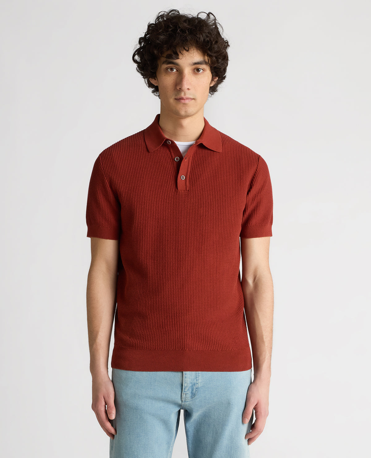 Man wearing a orange Slim Fit Cotton Interest Fabric Polo Shirt