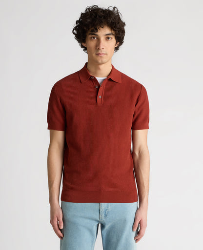 Man wearing a orange Slim Fit Cotton Interest Fabric Polo Shirt
