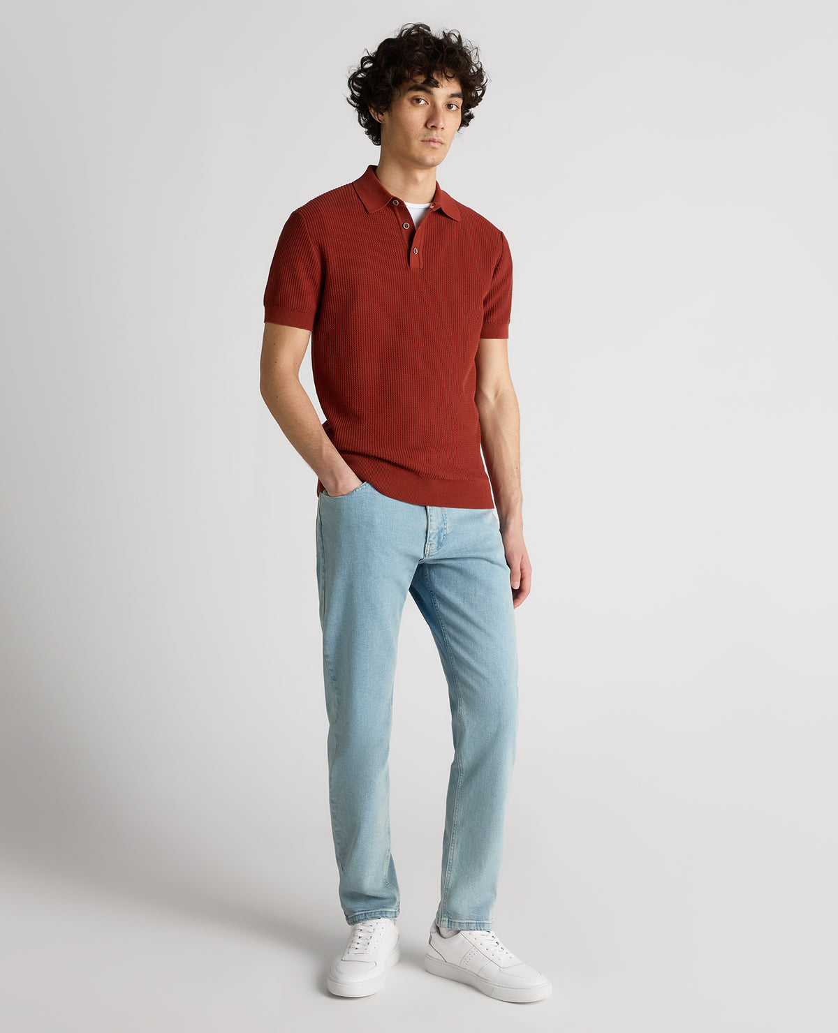 Man wearing a orange Slim Fit Cotton Interest Fabric Polo Shirt