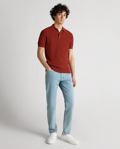 Man wearing a orange Slim Fit Cotton Interest Fabric Polo Shirt