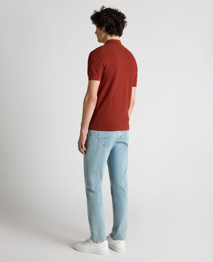 Man wearing a orange Slim Fit Cotton Interest Fabric Polo Shirt