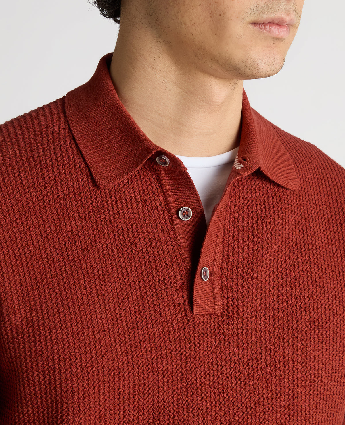 Man wearing a orange Slim Fit Cotton Interest Fabric Polo Shirt
