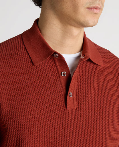 Man wearing a orange Slim Fit Cotton Interest Fabric Polo Shirt