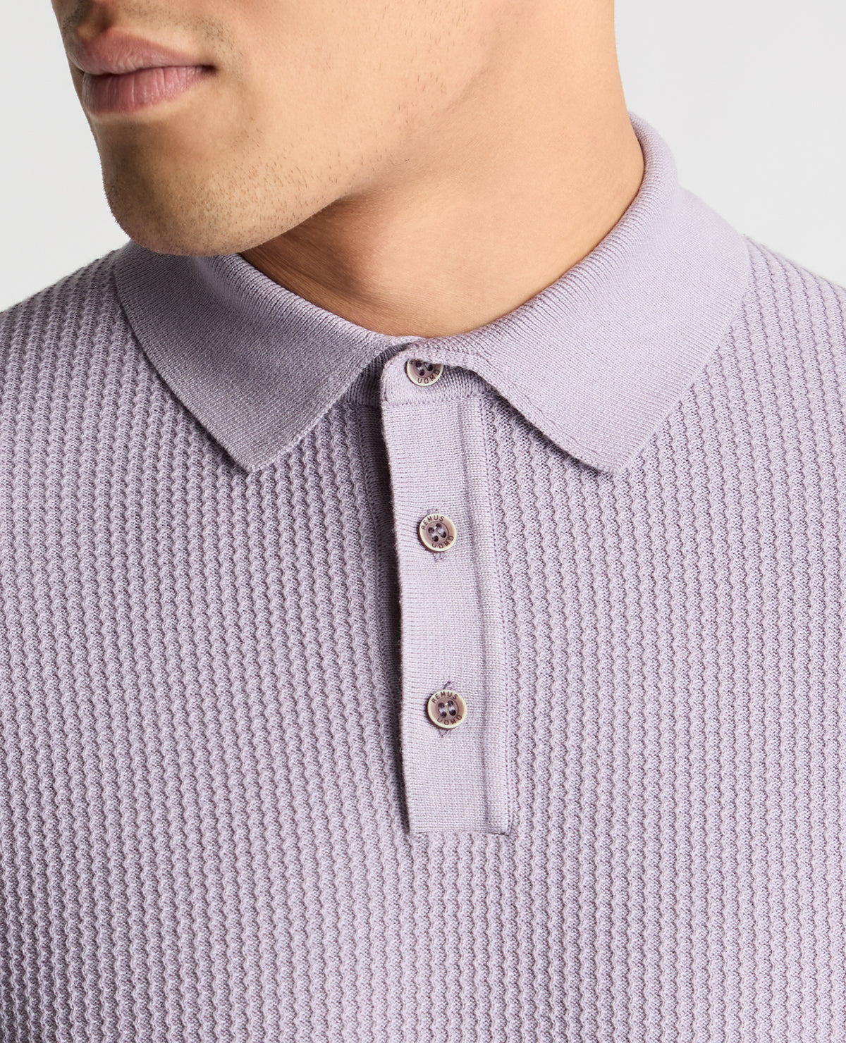 Man wearing a purple  jumper