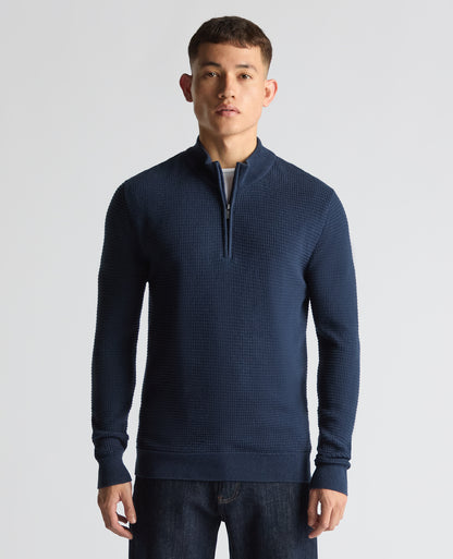 Man wearing a blue Tapered Fit Cotton Half Zip Sweater