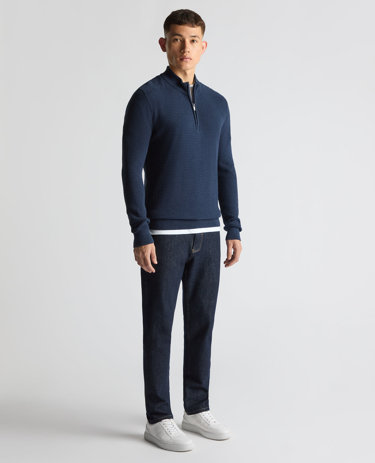 Man wearing a blue Tapered Fit Cotton Half Zip Sweater