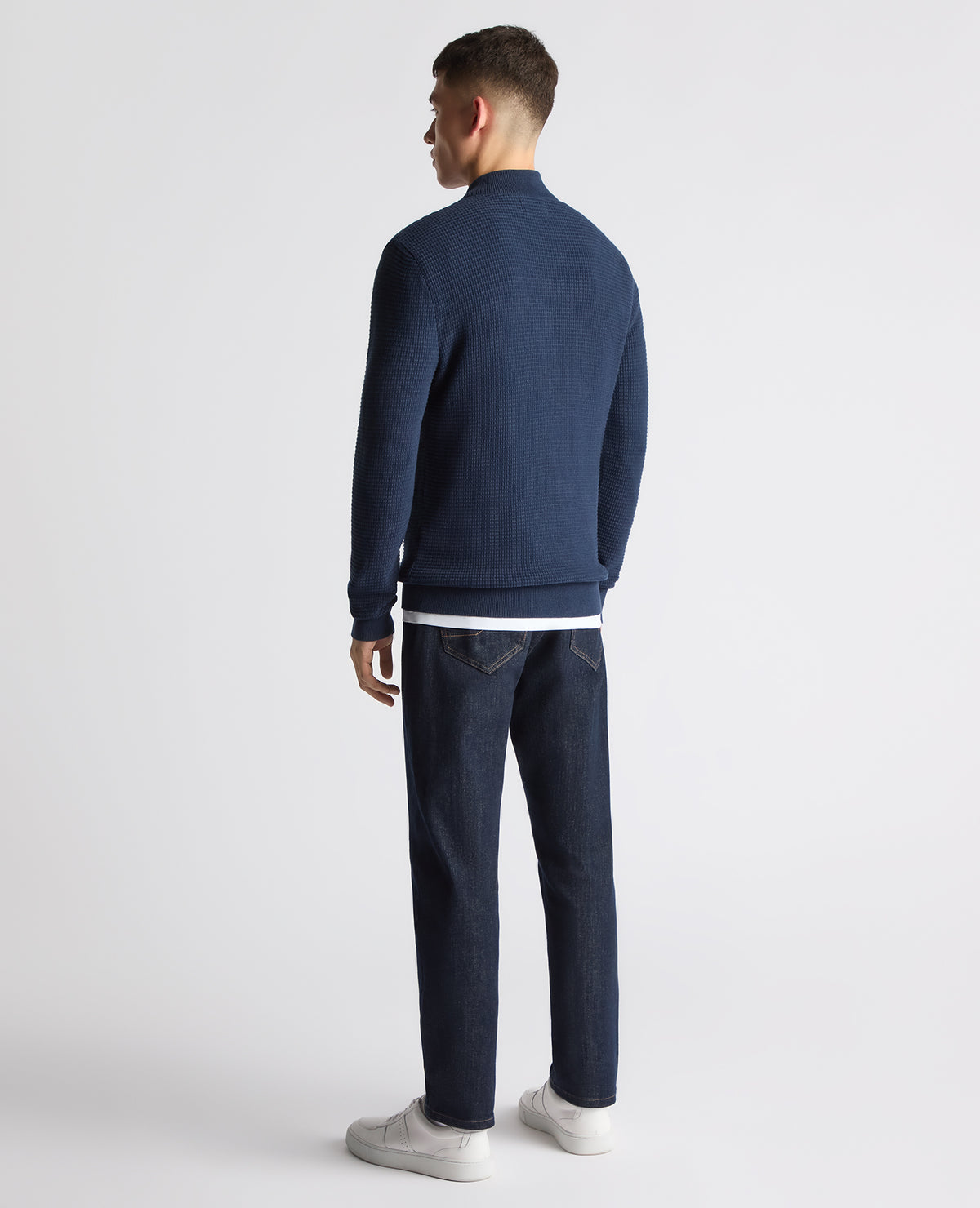 Man wearing a blue Tapered Fit Cotton Half Zip Sweater