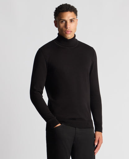 Man wearing a black Tapered Fit Roll Neck Sweater